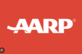 White AARP logo on a red background.